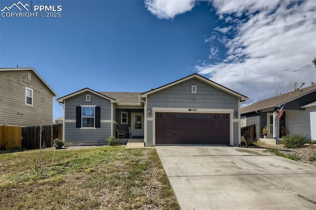 ranch-style house featuring a garage and a front lawn