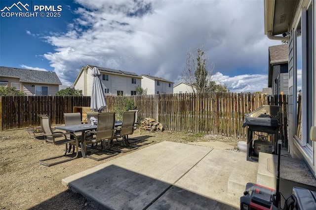 view of patio featuring a grill