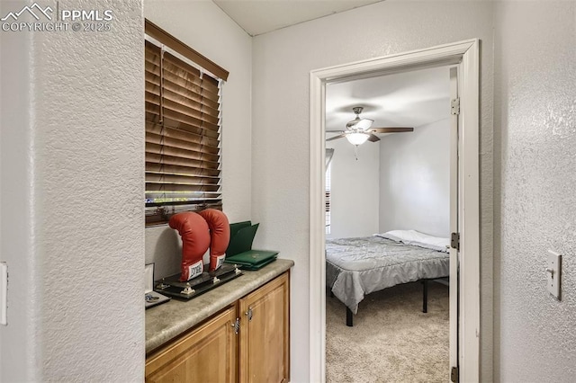 carpeted bedroom with ceiling fan