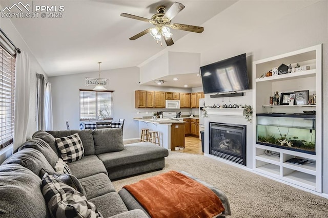 living room with ceiling fan, built in features, light carpet, and lofted ceiling