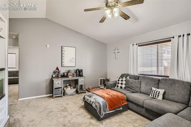 carpeted living room with ceiling fan and lofted ceiling