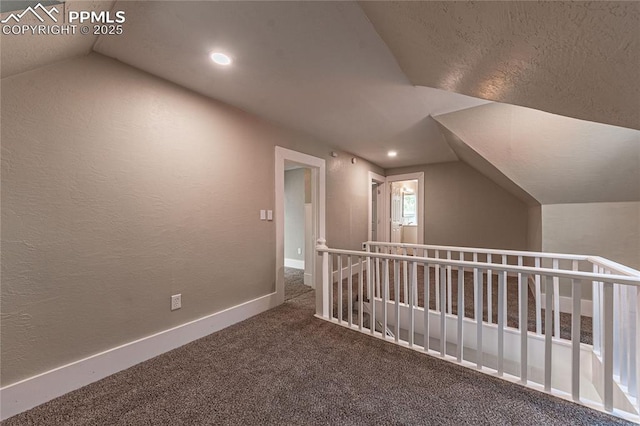 additional living space with lofted ceiling and carpet floors