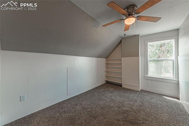 bonus room with carpet, ceiling fan, and lofted ceiling