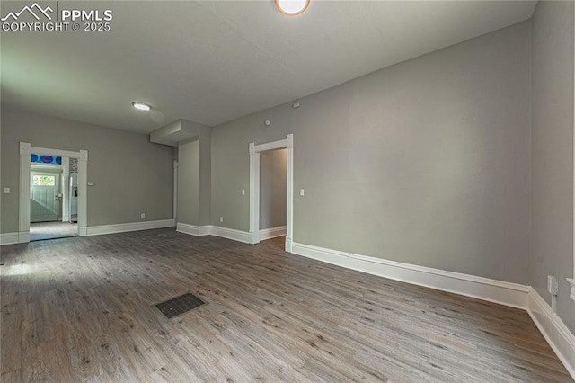 spare room featuring hardwood / wood-style flooring