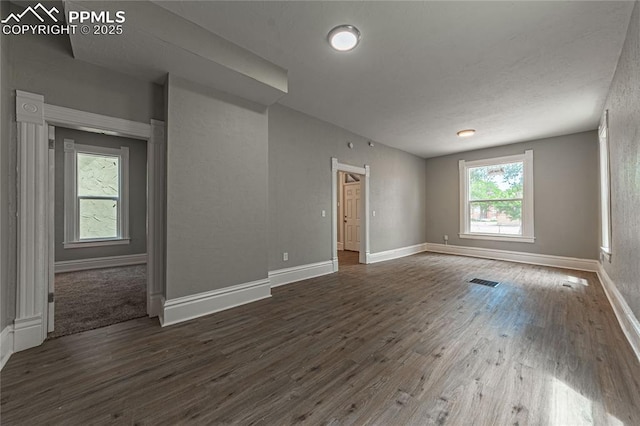 empty room featuring dark hardwood / wood-style floors