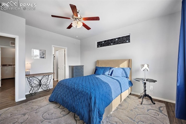 bedroom featuring a walk in closet, hardwood / wood-style floors, and ceiling fan