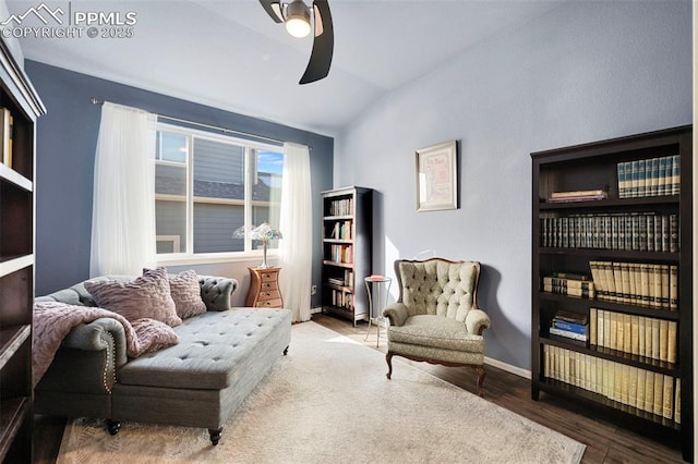 sitting room featuring ceiling fan, lofted ceiling, and wood-type flooring