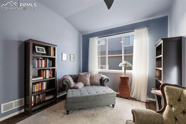 living area with vaulted ceiling