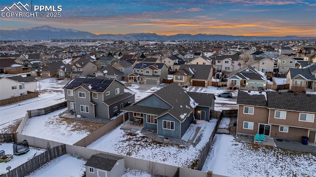 snowy aerial view featuring a mountain view