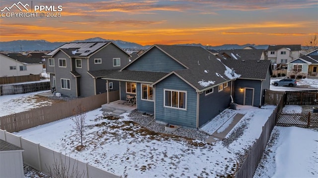 front of property with a mountain view