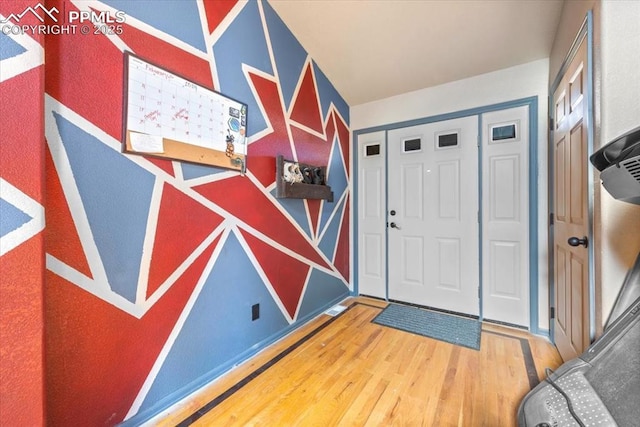 entrance foyer with hardwood / wood-style floors