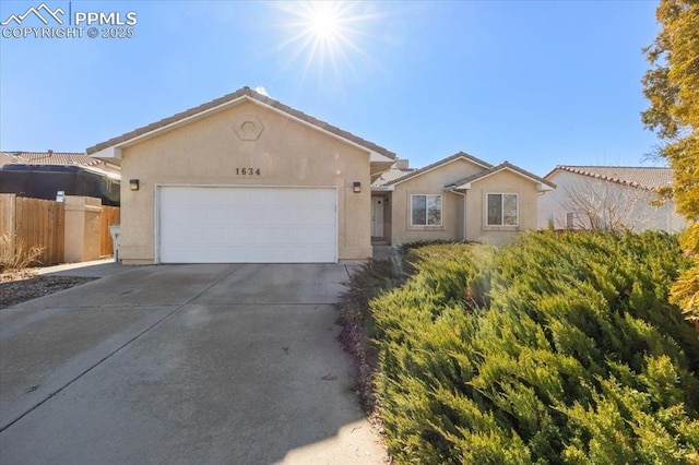 ranch-style home featuring a garage