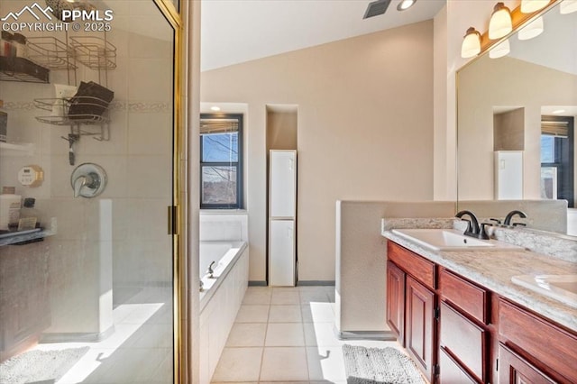 bathroom with tile patterned floors, vanity, independent shower and bath, and vaulted ceiling