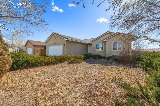 single story home with a garage