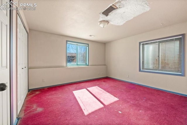 unfurnished bedroom with carpet floors