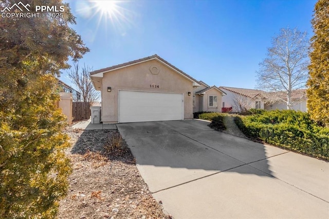 single story home featuring a garage