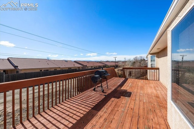 wooden deck with area for grilling