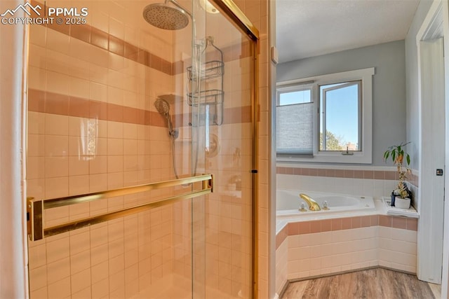 bathroom featuring wood-type flooring and independent shower and bath