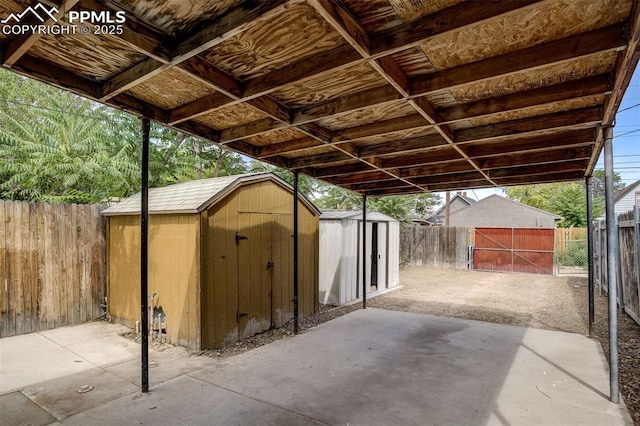 view of patio featuring a storage shed