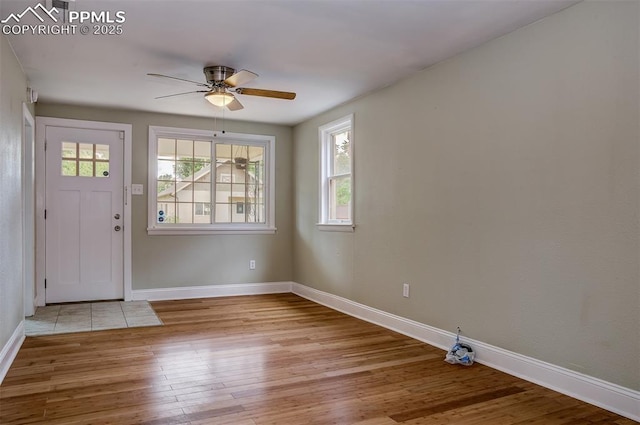 entrance foyer with ceiling fan and light hardwood / wood-style floors