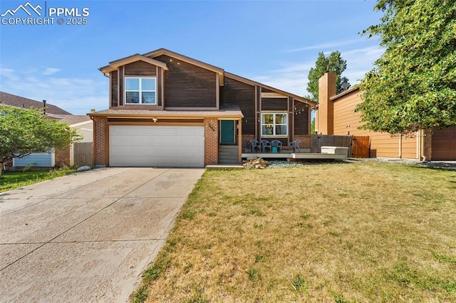 view of front of home with a front yard and a garage