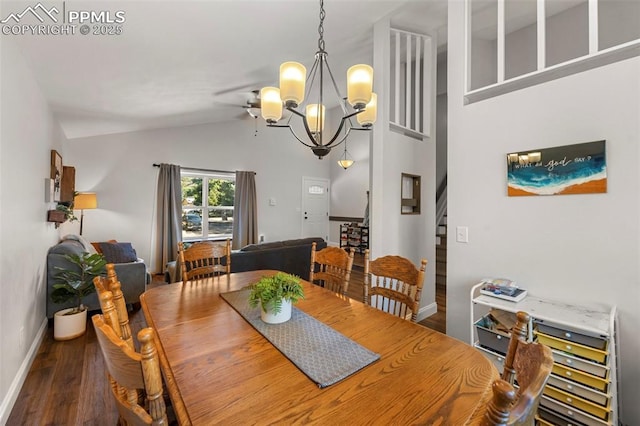 dining room with hardwood / wood-style floors, ceiling fan with notable chandelier, and lofted ceiling