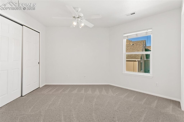 unfurnished bedroom with ceiling fan and carpet flooring