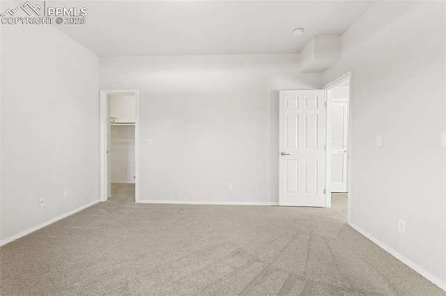 unfurnished room featuring light colored carpet