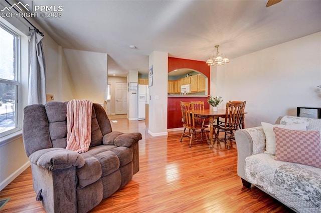 living room featuring hardwood / wood-style floors and a chandelier