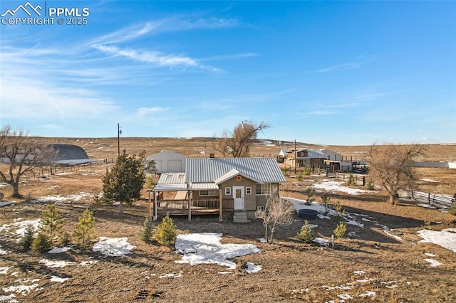 back of house with a wooden deck