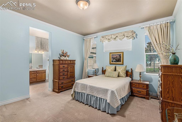 bedroom featuring connected bathroom, crown molding, and light colored carpet