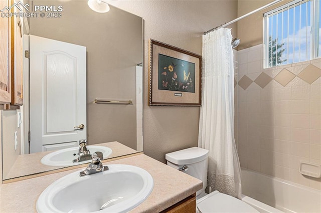 full bathroom featuring toilet, shower / tub combo, and vanity