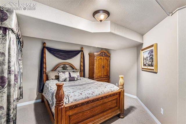 carpeted bedroom with a textured ceiling