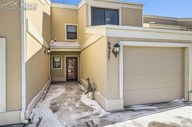 entrance to property featuring a garage