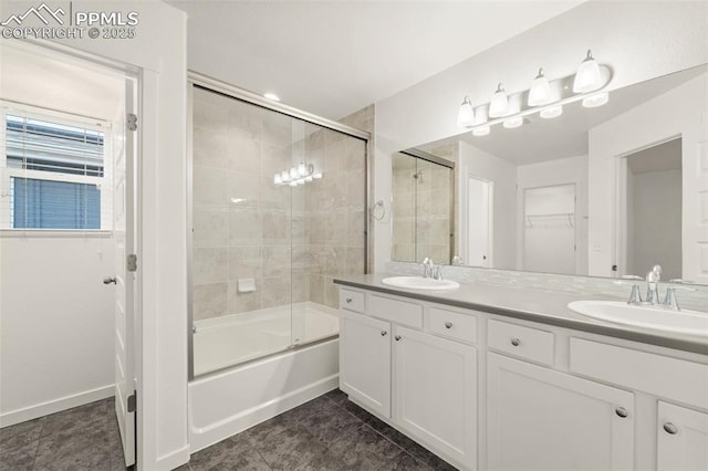 bathroom with tile patterned flooring, vanity, and combined bath / shower with glass door