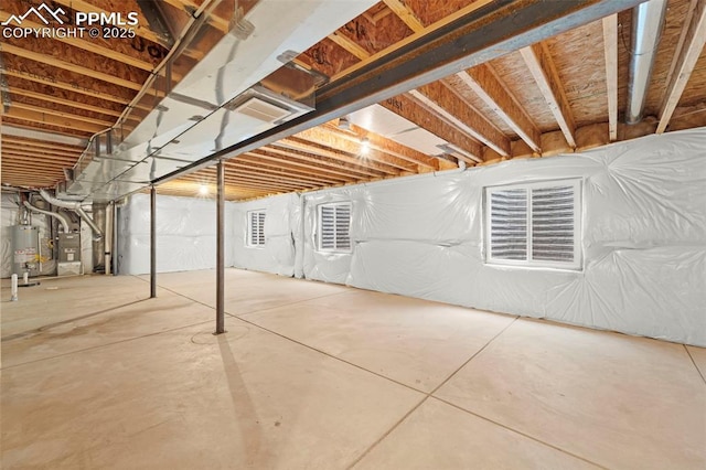 basement with gas water heater and heating unit