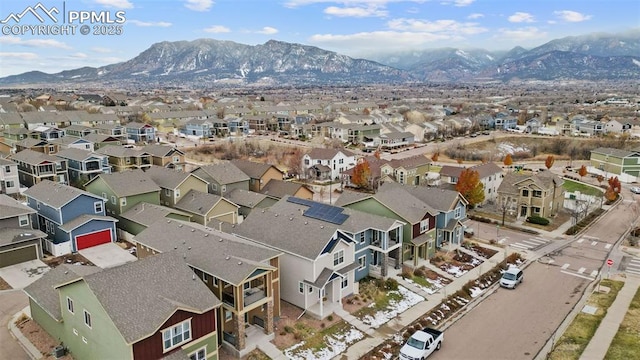 birds eye view of property with a mountain view