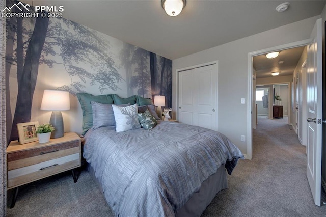 carpeted bedroom featuring a closet