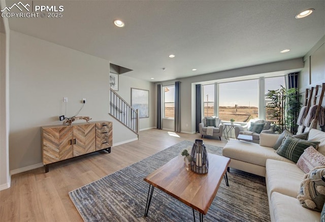 living room with light hardwood / wood-style flooring