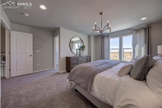 carpeted bedroom with an inviting chandelier