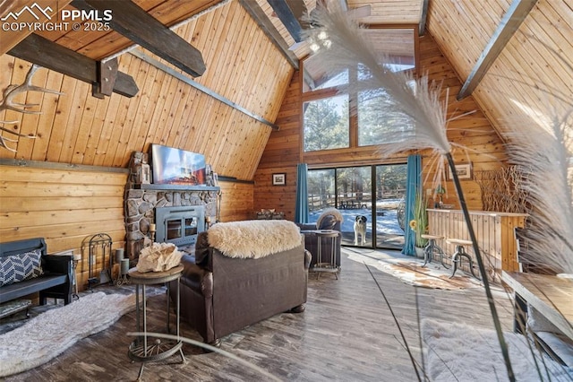 living room with beam ceiling, a fireplace, wooden ceiling, and wood walls