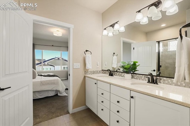 bathroom with tile patterned floors, vanity, and backsplash