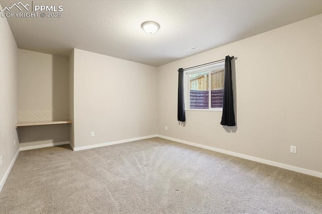 unfurnished room with carpet flooring