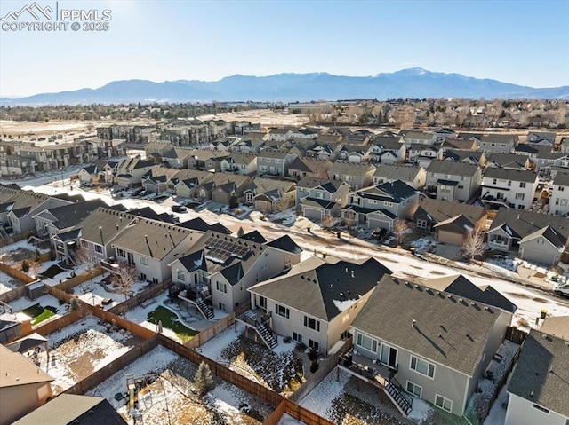 birds eye view of property with a mountain view