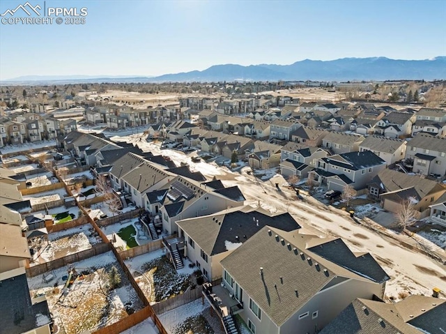 birds eye view of property with a mountain view