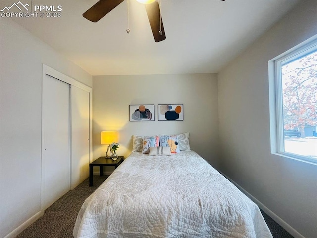 carpeted bedroom with multiple windows, a closet, and ceiling fan