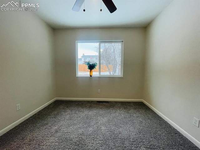 carpeted empty room featuring ceiling fan