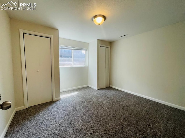 unfurnished bedroom featuring carpet