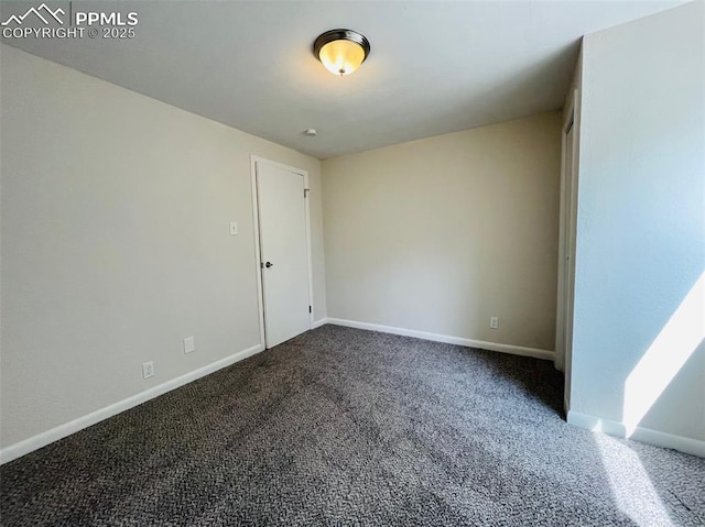 unfurnished room featuring carpet flooring