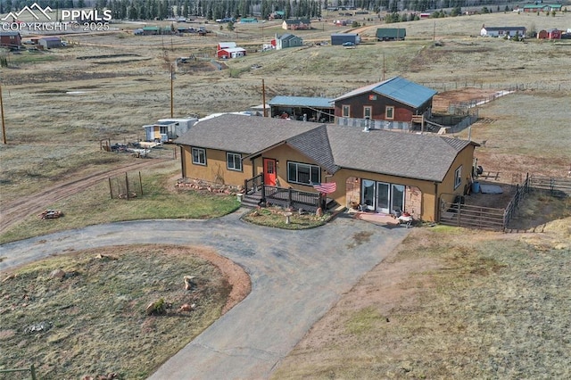 birds eye view of property featuring a rural view